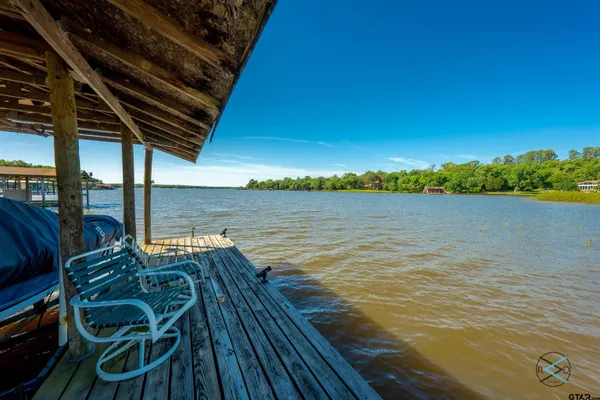 a view of a garage with rack and bicycle