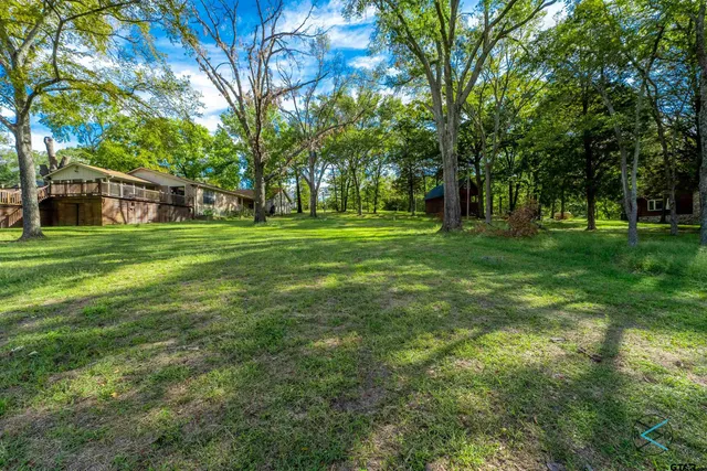 a backyard of a house with lots of green space
