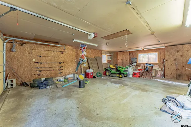 a view of a garage with rack and bicycle