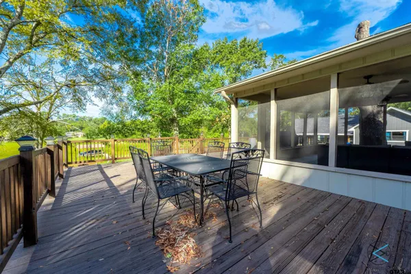 a view of a patio with a table and chairs