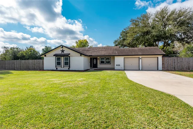 a house with swimming pool in front of it