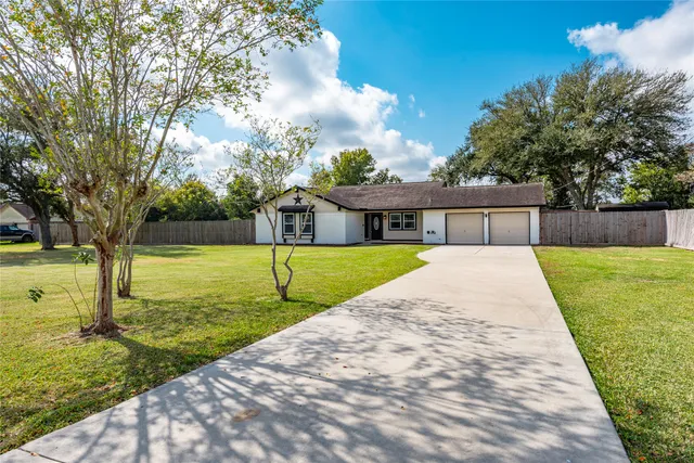 a house with swimming pool in front of it
