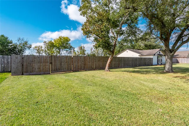 a swimming pool with wooden fence