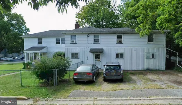 a car parked in front of a house