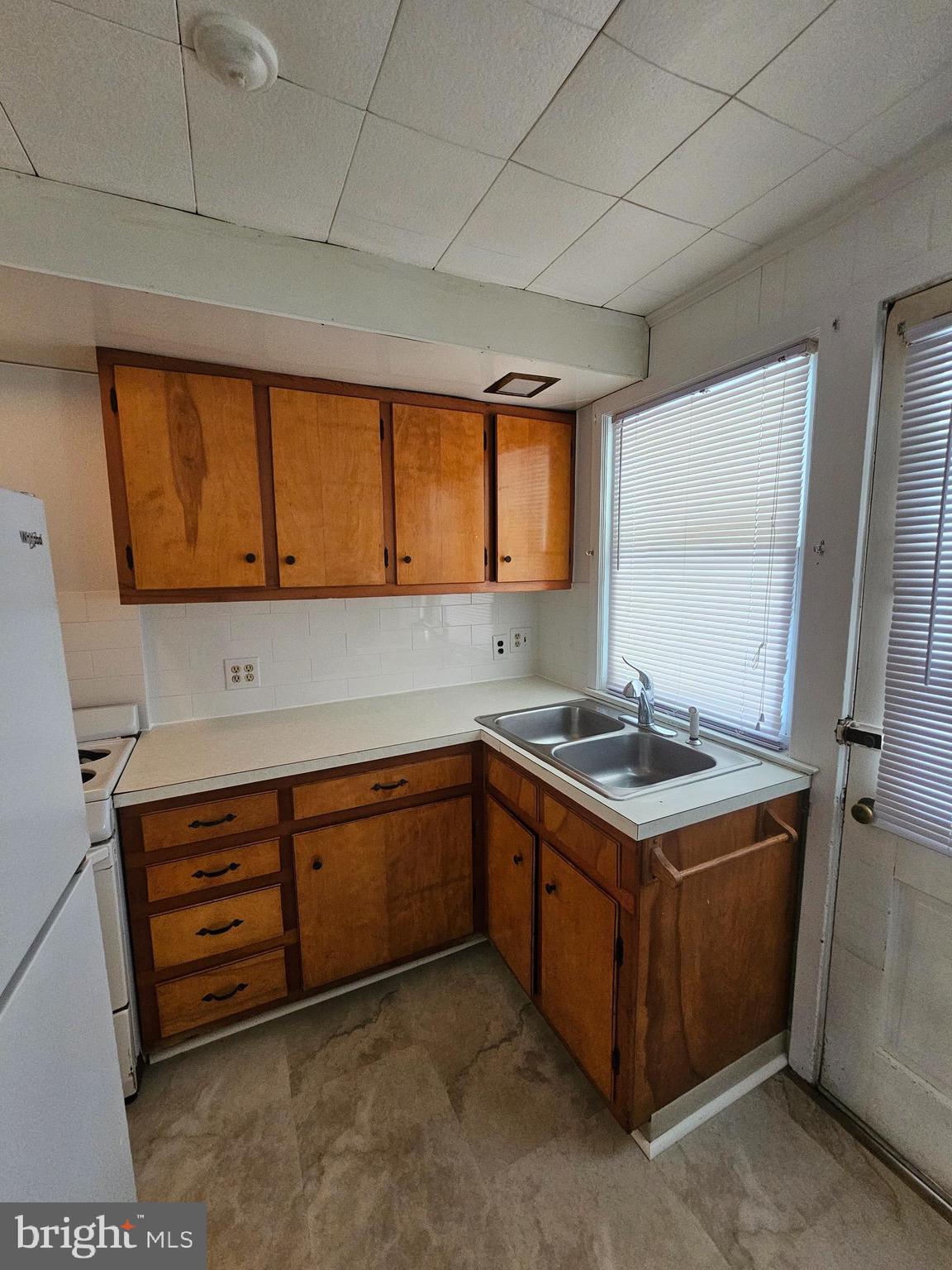303 Delaware Circle, Unit 4 Newark, DE 19711 - Photo 10 of 14 a kitchen with stainless steel appliances granite countertop a sink and a stove