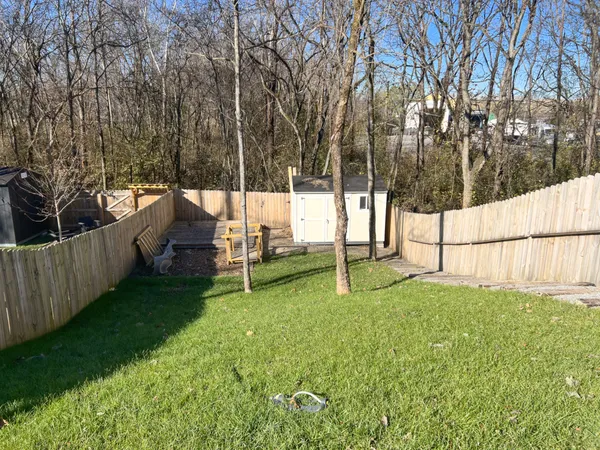 a view of a backyard with pathway