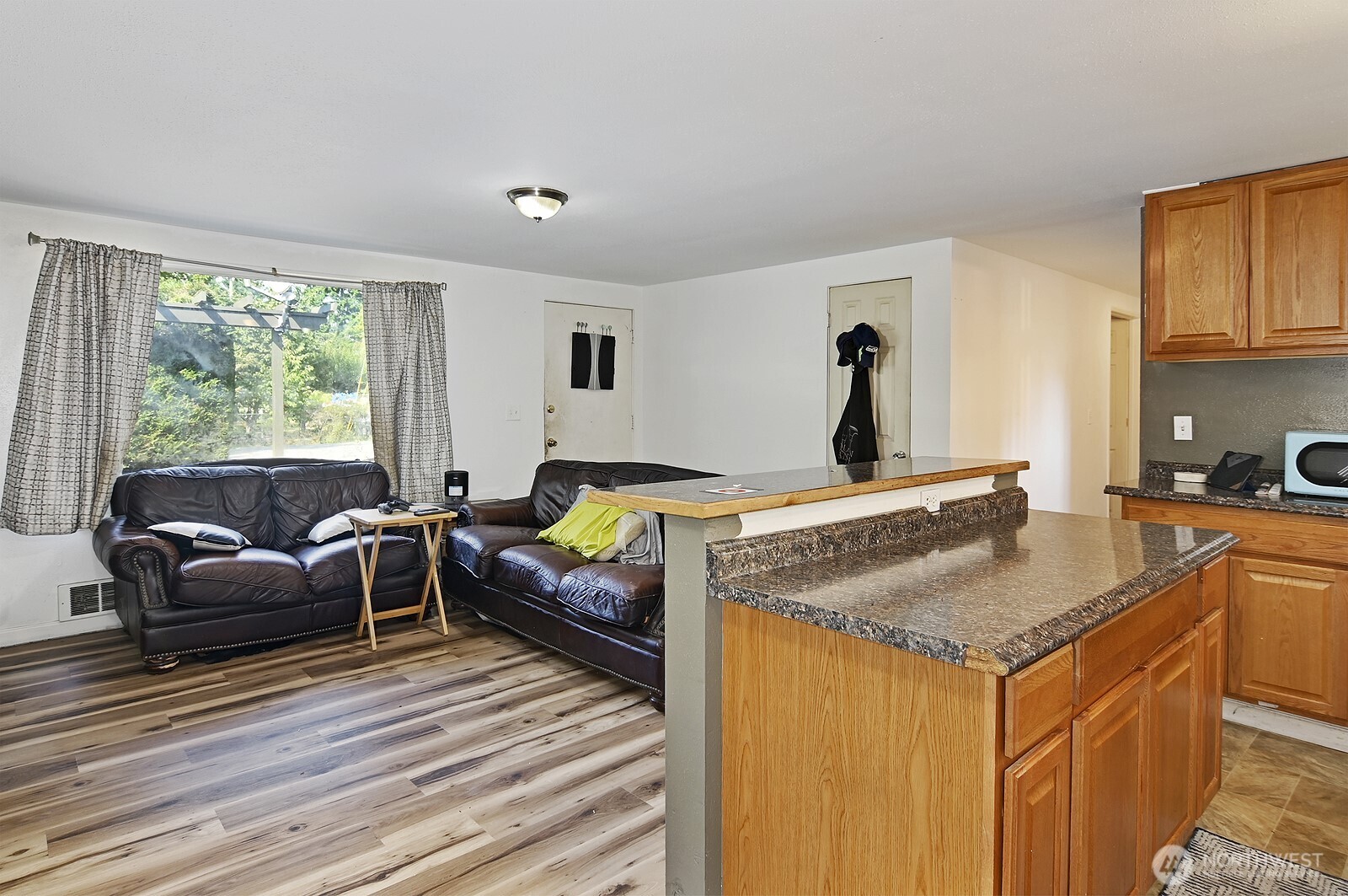 15002 4th Avenue South Burien, WA 98148 - Photo 11 of 30 a view of a kitchen counter top space and wooden floor