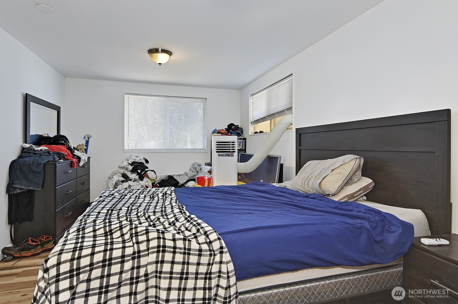 15002 4th Avenue South Burien, WA 98148 - Photo 12 of 30 a bed sitting in a bedroom next to a window