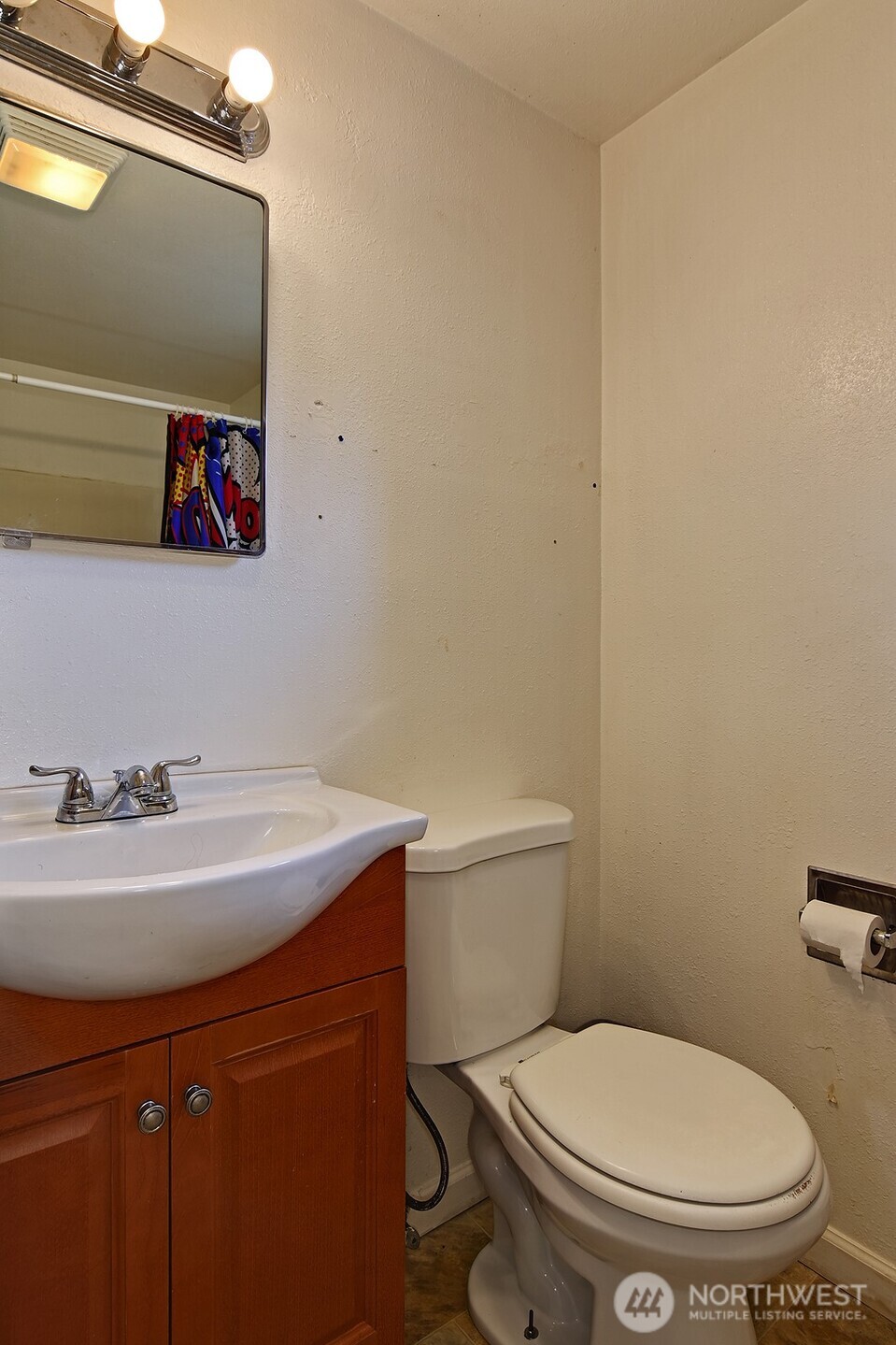 15002 4th Avenue South Burien, WA 98148 - Photo 13 of 30 a bathroom with a toilet a sink and mirror