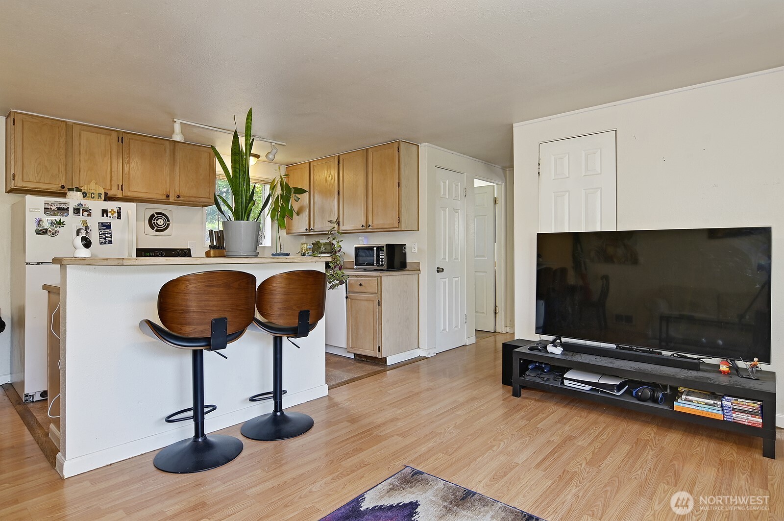 15002 4th Avenue South Burien, WA 98148 - Photo 17 of 30 a living room with furniture and a flat screen tv