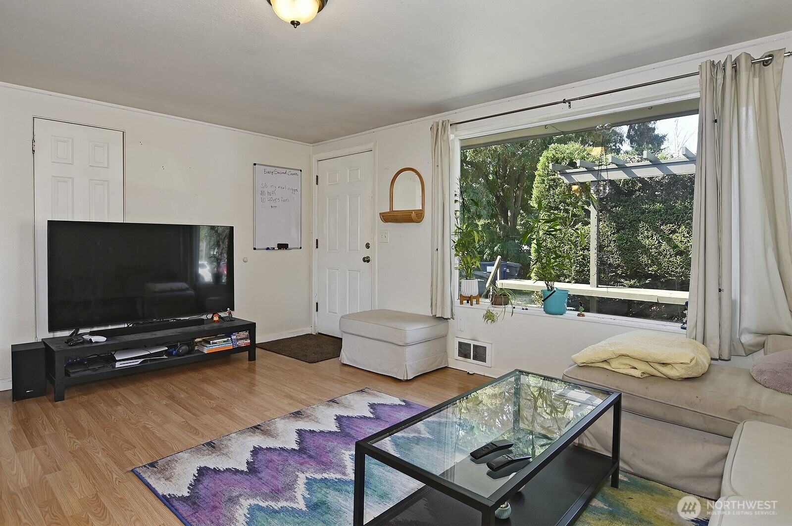 15002 4th Avenue South Burien, WA 98148 - Photo 18 of 30 a living room with furniture and a flat screen tv