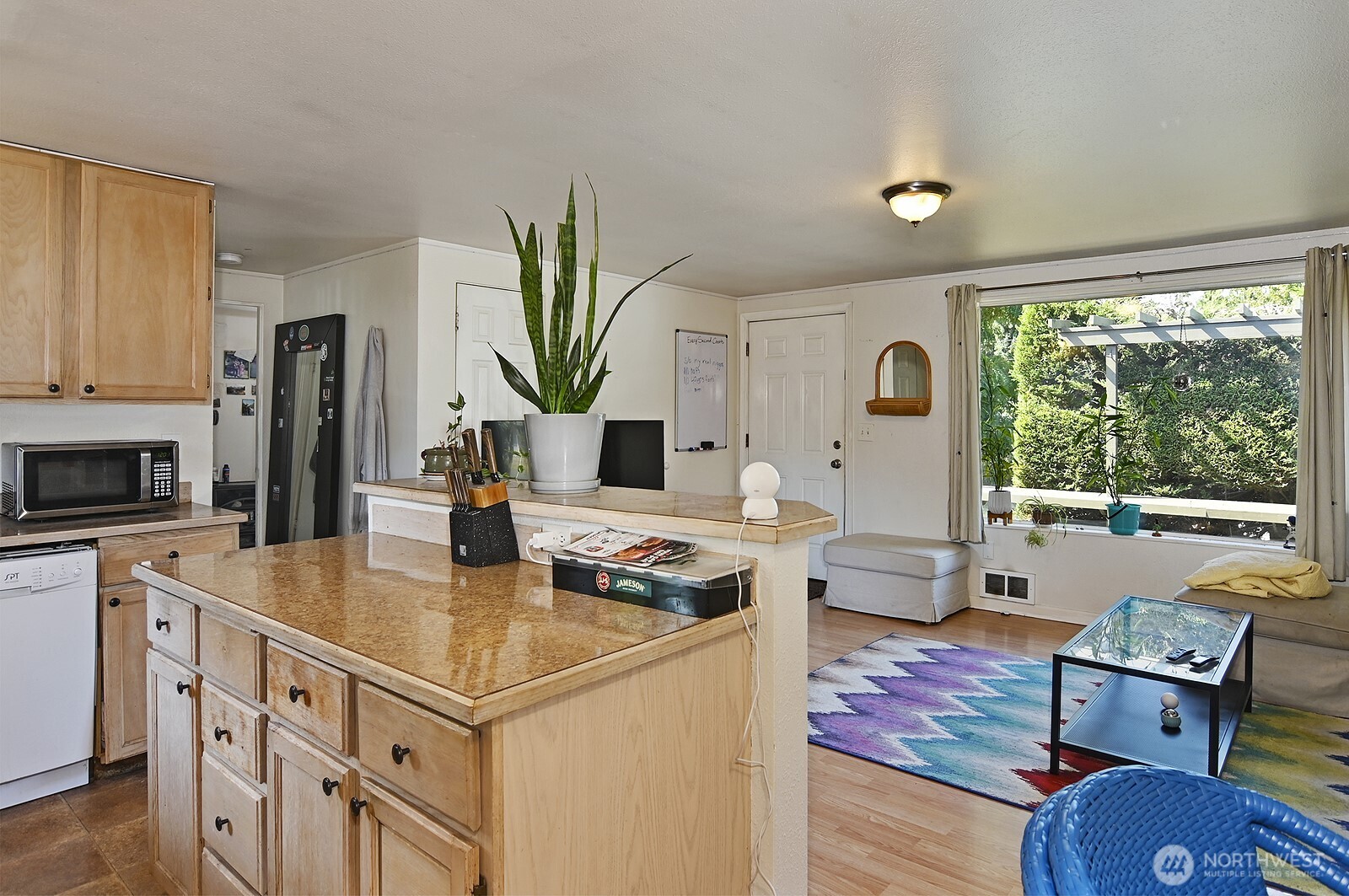 15002 4th Avenue South Burien, WA 98148 - Photo 21 of 30 a living room with furniture a large window with kitchen view