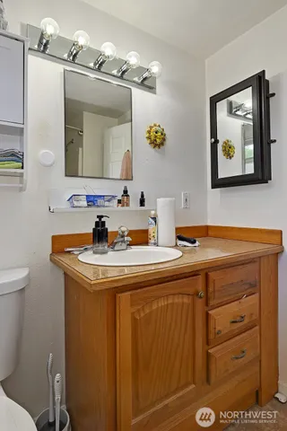 a bathroom with a sink and a mirror