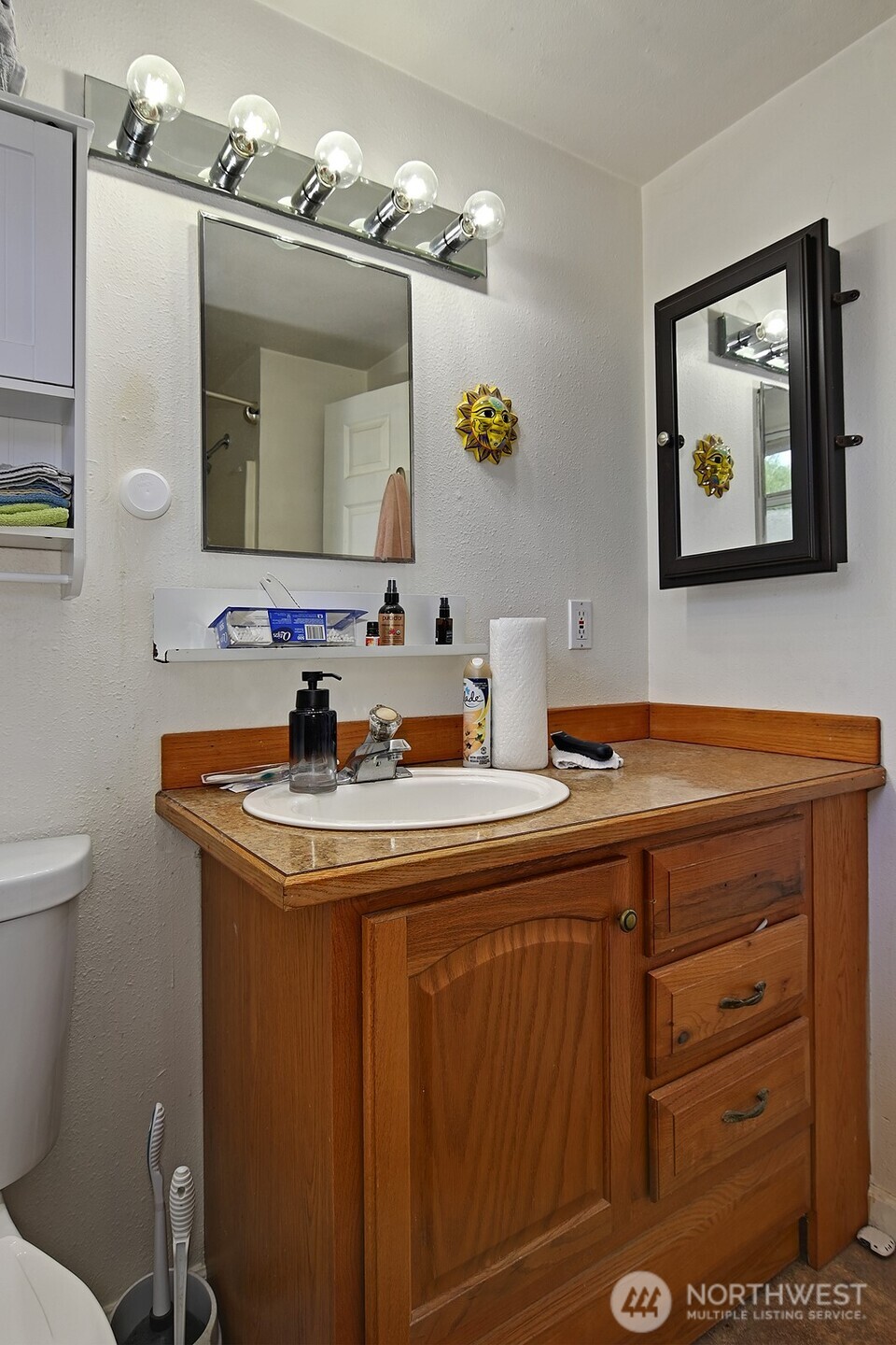 15002 4th Avenue South Burien, WA 98148 - Photo 24 of 30 a bathroom with a sink and a mirror