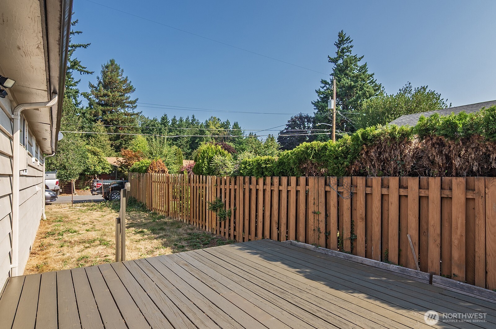 15002 4th Avenue South Burien, WA 98148 - Photo 26 of 30 a view of deck with wooden floor and fence with plants