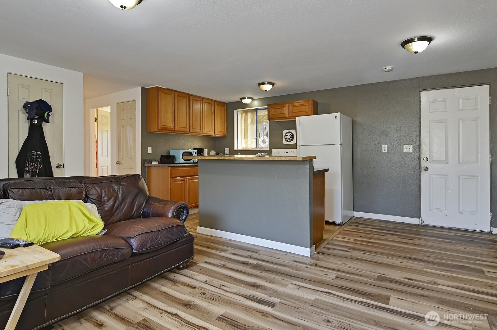 15002 4th Avenue South Burien, WA 98148 - Photo 4 of 30 a living room with kitchen and furniture