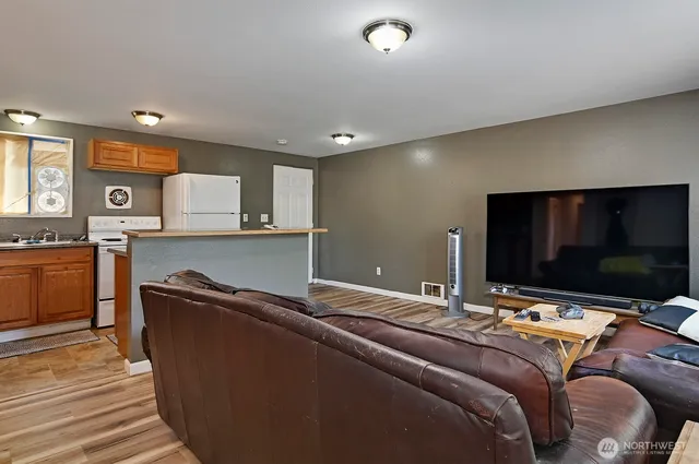 a room with a bed and flat screen tv