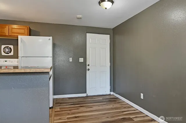 a view of a livingroom with wooden floor