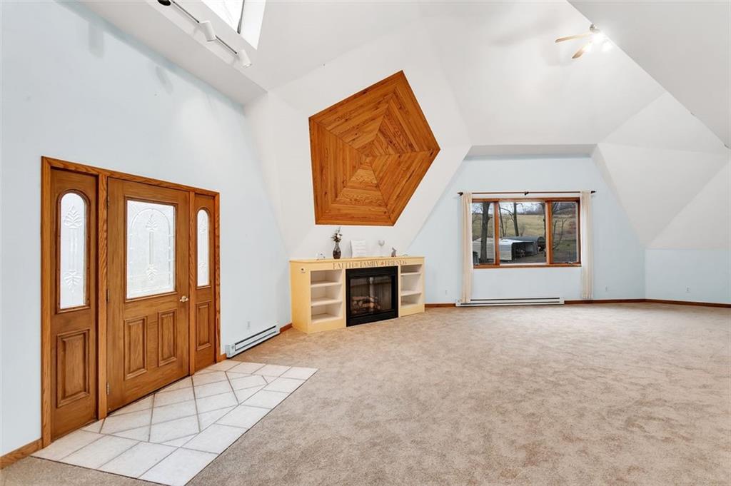 173 Harvey Road Sarver, PA 16055 - Photo 5 of 25 an empty room with furniture and a fireplace