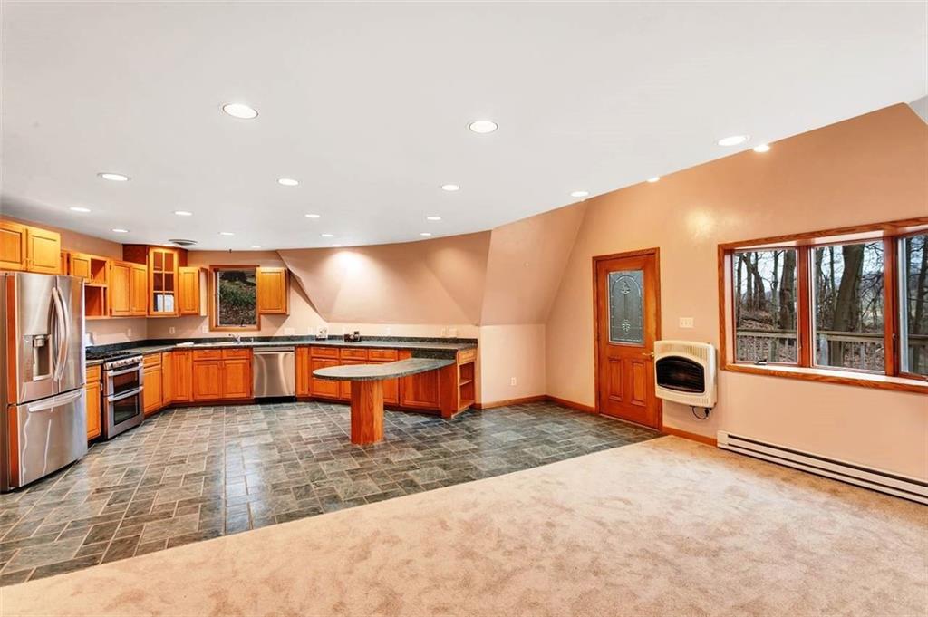 173 Harvey Road Sarver, PA 16055 - Photo 7 of 25 an empty room with wooden floor