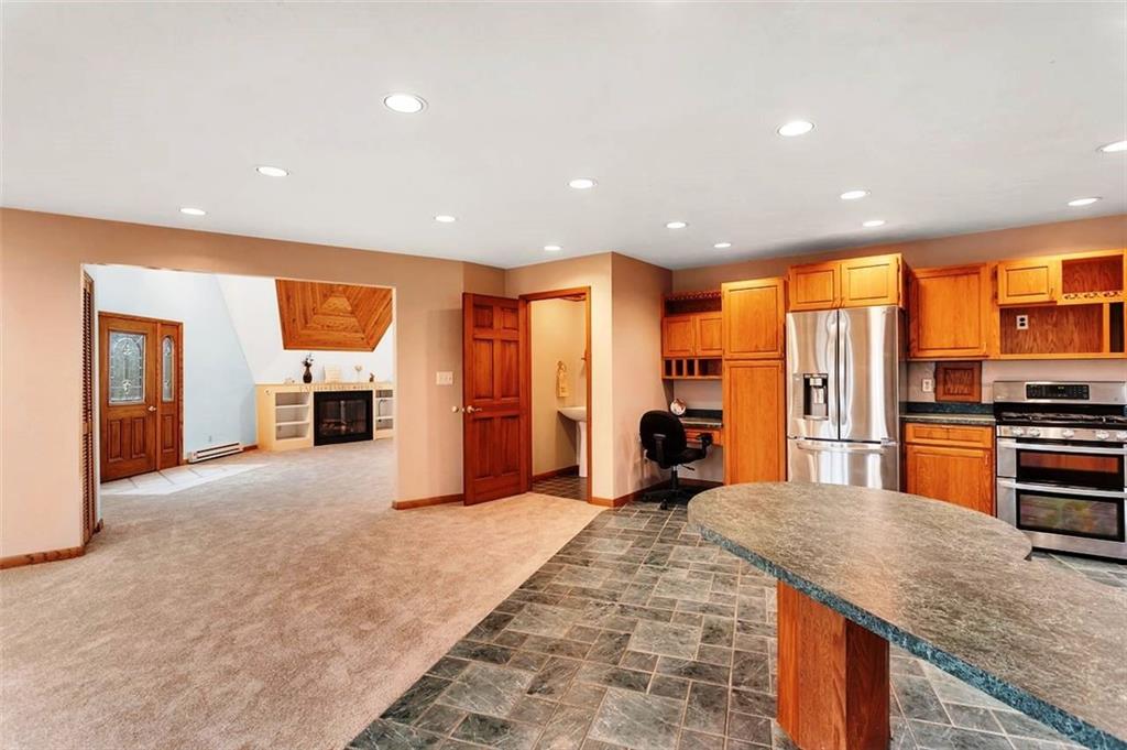 173 Harvey Road Sarver, PA 16055 - Photo 8 of 25 a kitchen with stainless steel appliances granite countertop a refrigerator a oven a sink and dishwasher