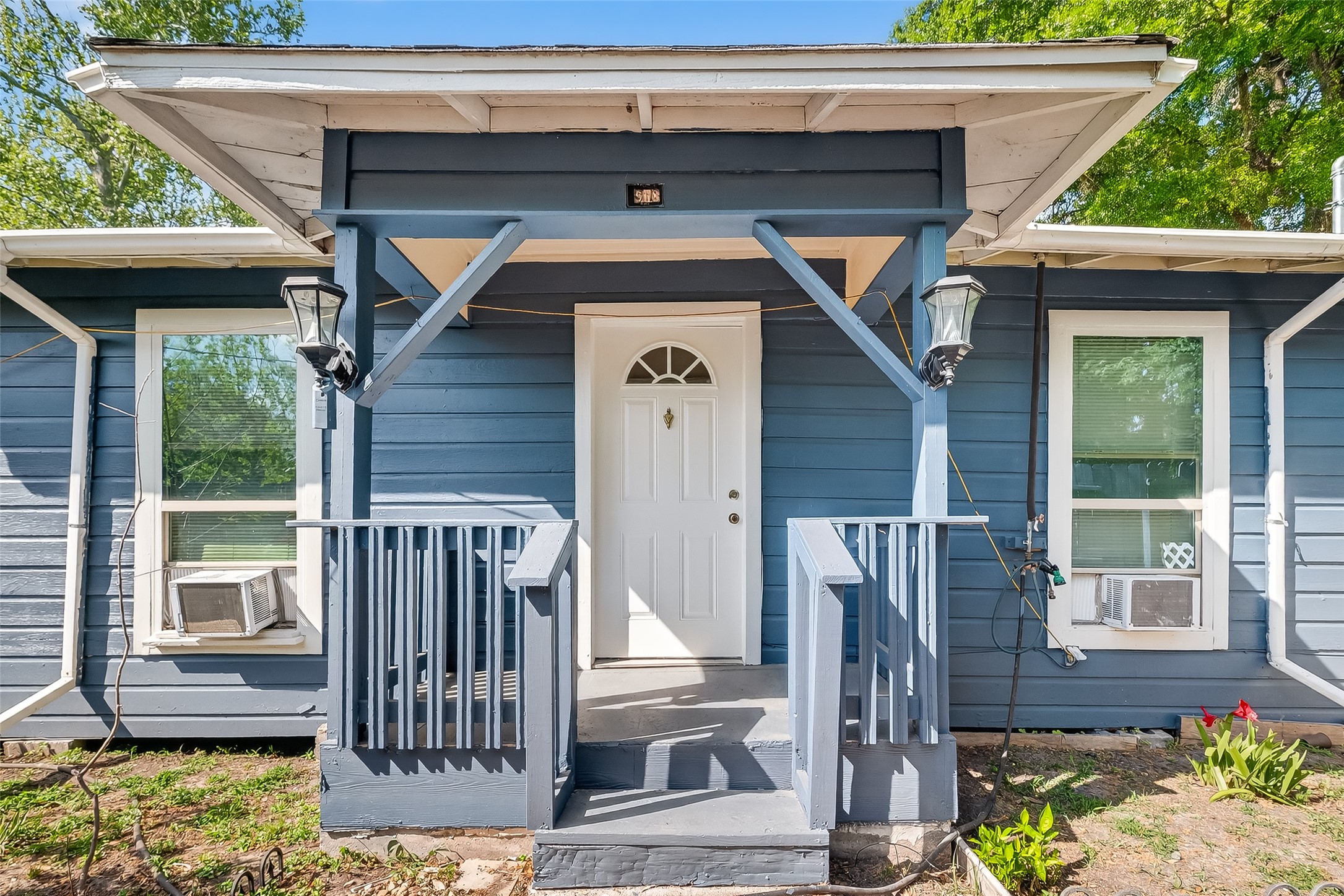 968 Garapan Street Houston, TX 77091 - Photo 1 of 40 a front view of a house with garden