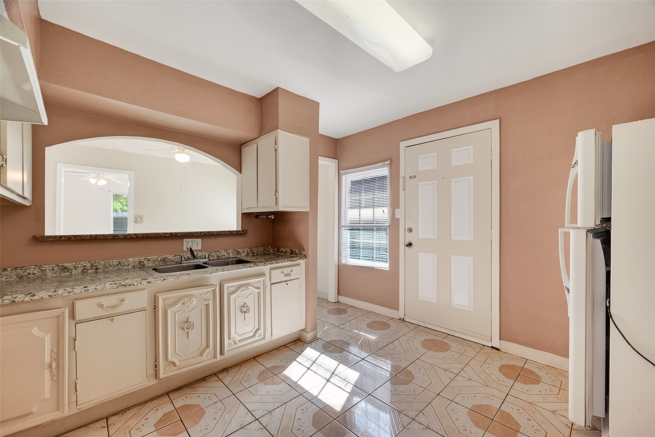 968 Garapan Street Houston, TX 77091 - Photo 15 of 40 a spacious bathroom with a granite countertop sink a mirror and a shower