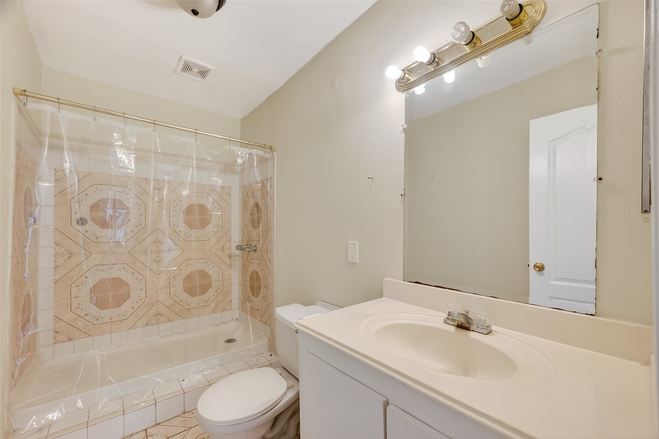 968 Garapan Street Houston, TX 77091 - Photo 18 of 40 a bathroom with a sink toilet and shower