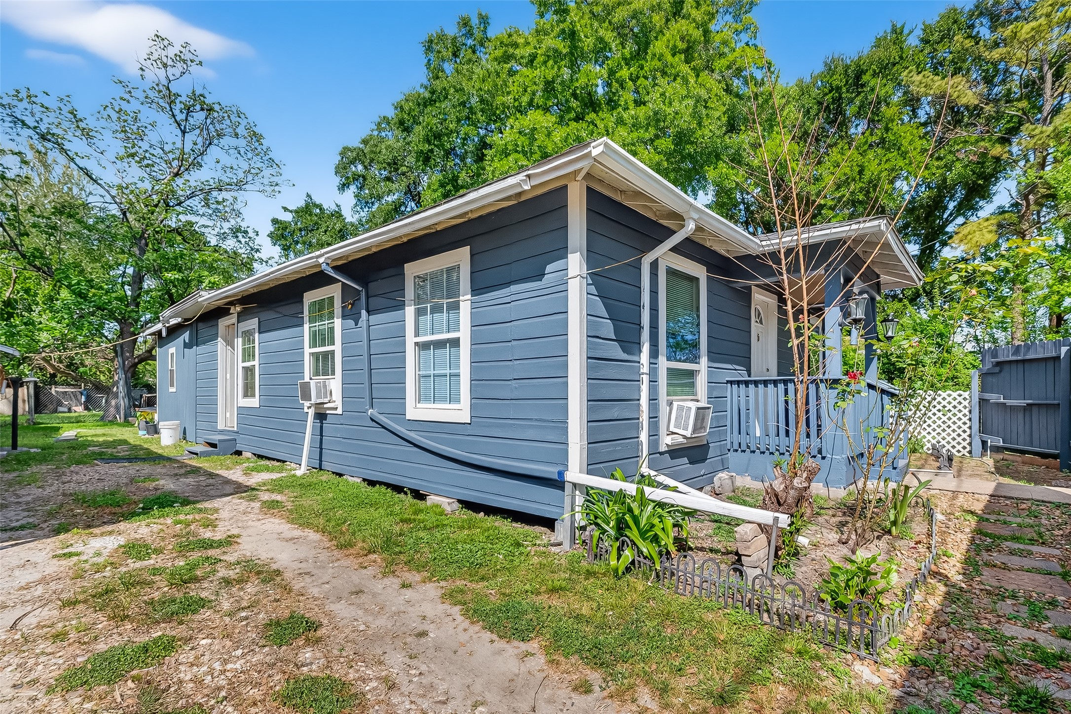 968 Garapan Street Houston, TX 77091 - Photo 2 of 40 a front view of a house with a yard table and chairs