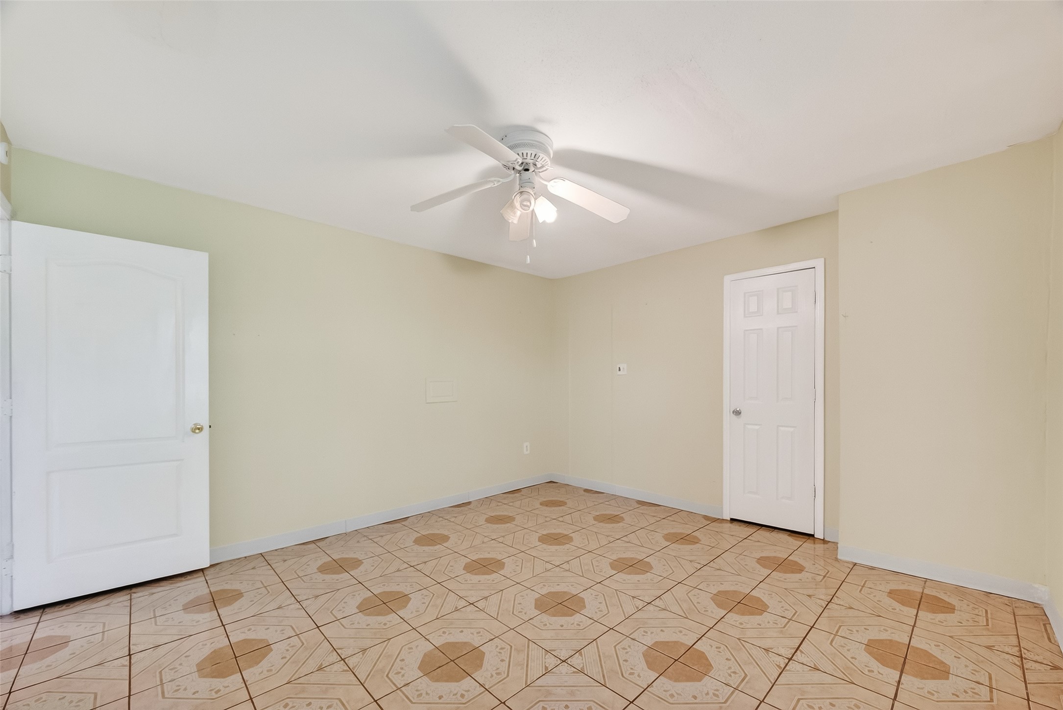 968 Garapan Street Houston, TX 77091 - Photo 23 of 40 a view of a room with a ceiling fan and a window