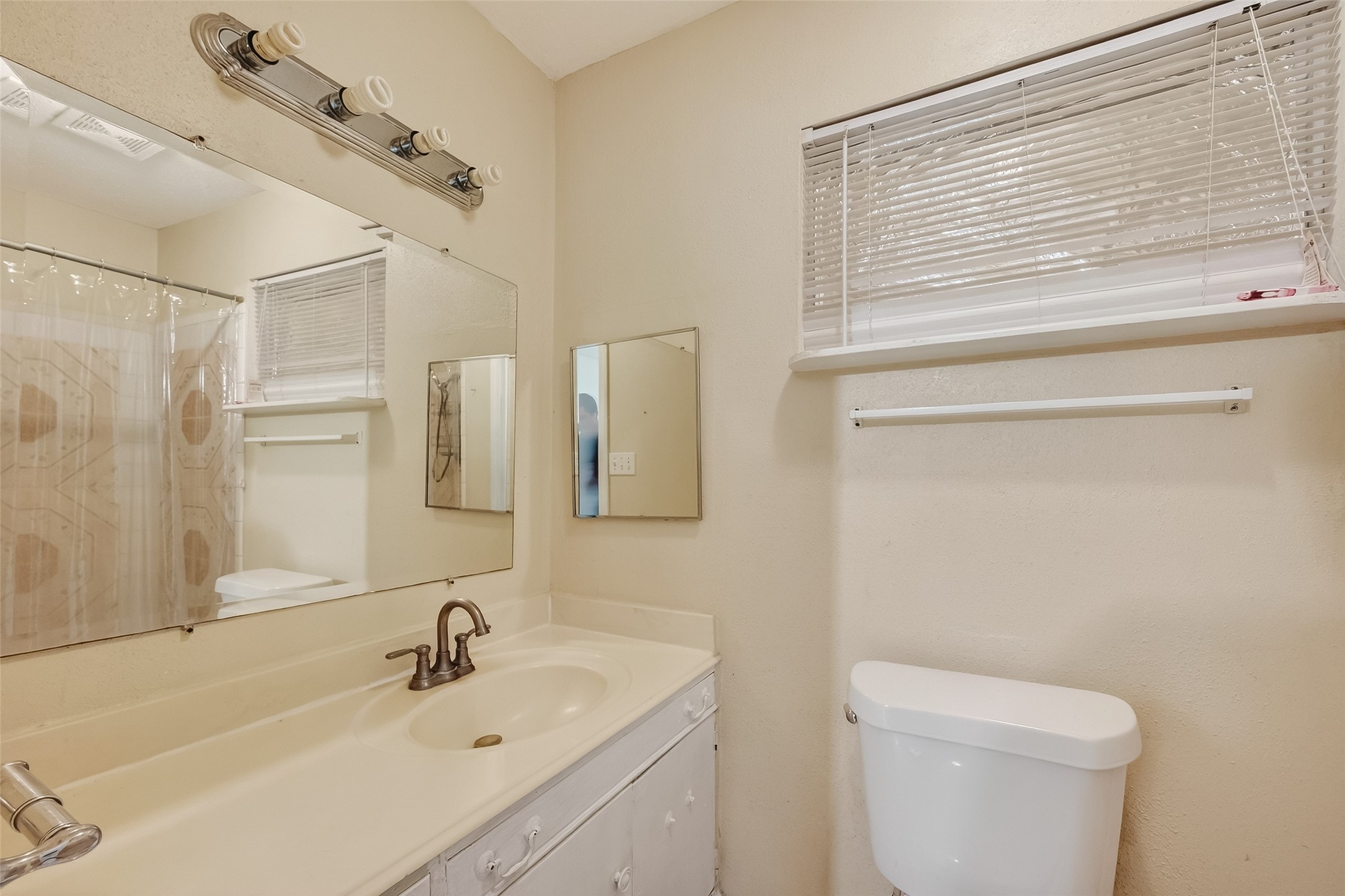 968 Garapan Street Houston, TX 77091 - Photo 28 of 40 a bathroom with a sink a toilet and shower