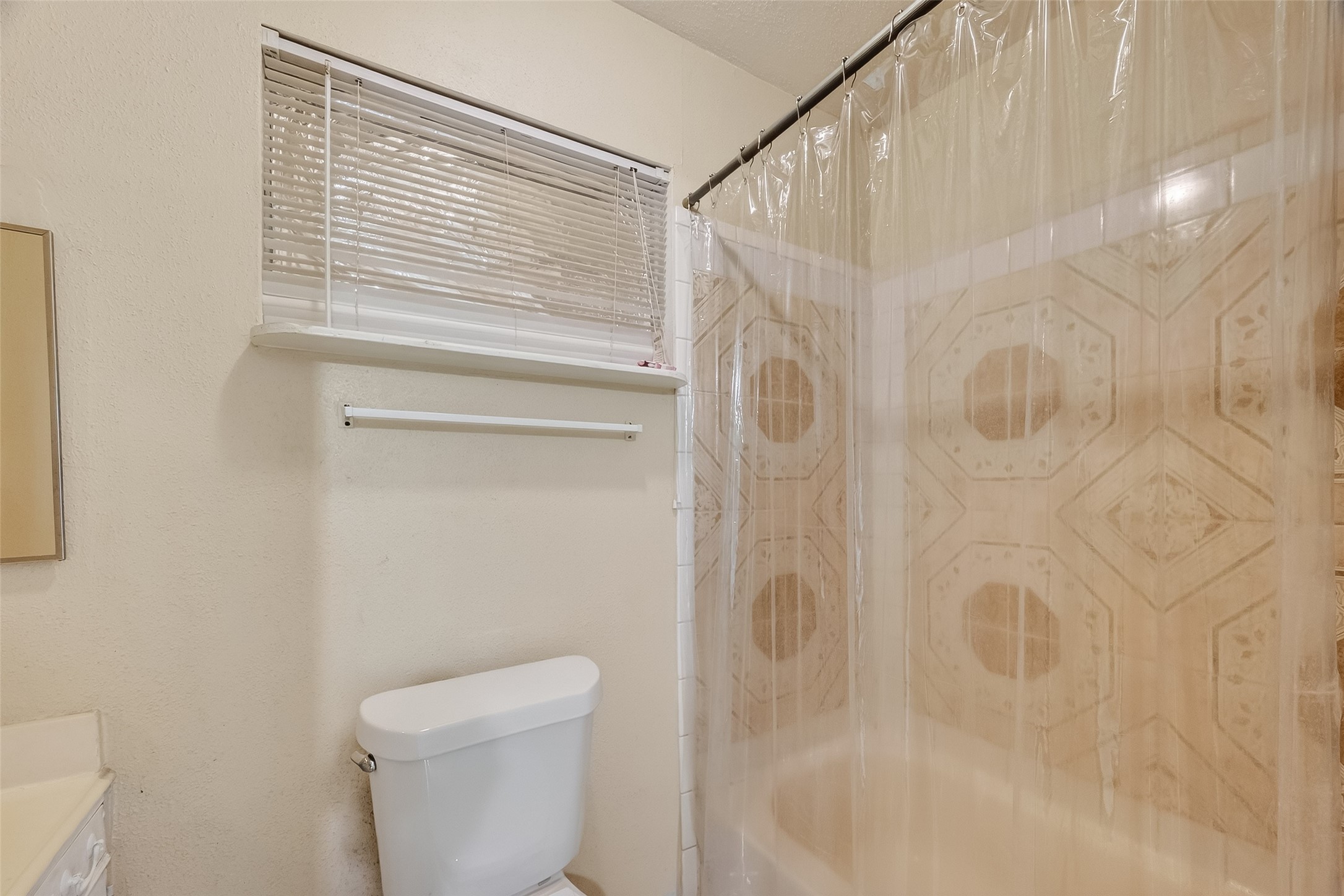 968 Garapan Street Houston, TX 77091 - Photo 29 of 40 a bathroom with a shower and a toilet