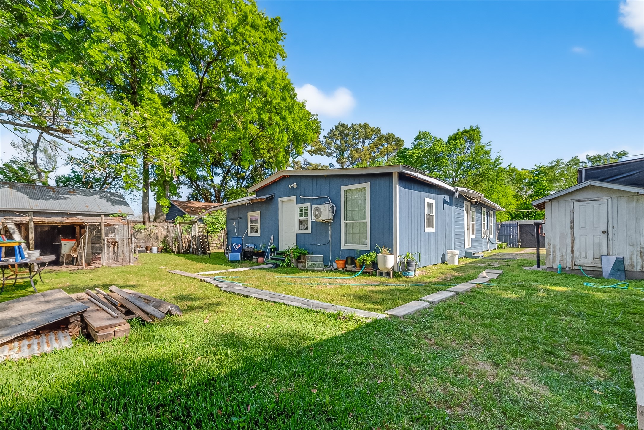 968 Garapan Street Houston, TX 77091 - Photo 30 of 40 a view of a house with a yard and sitting area
