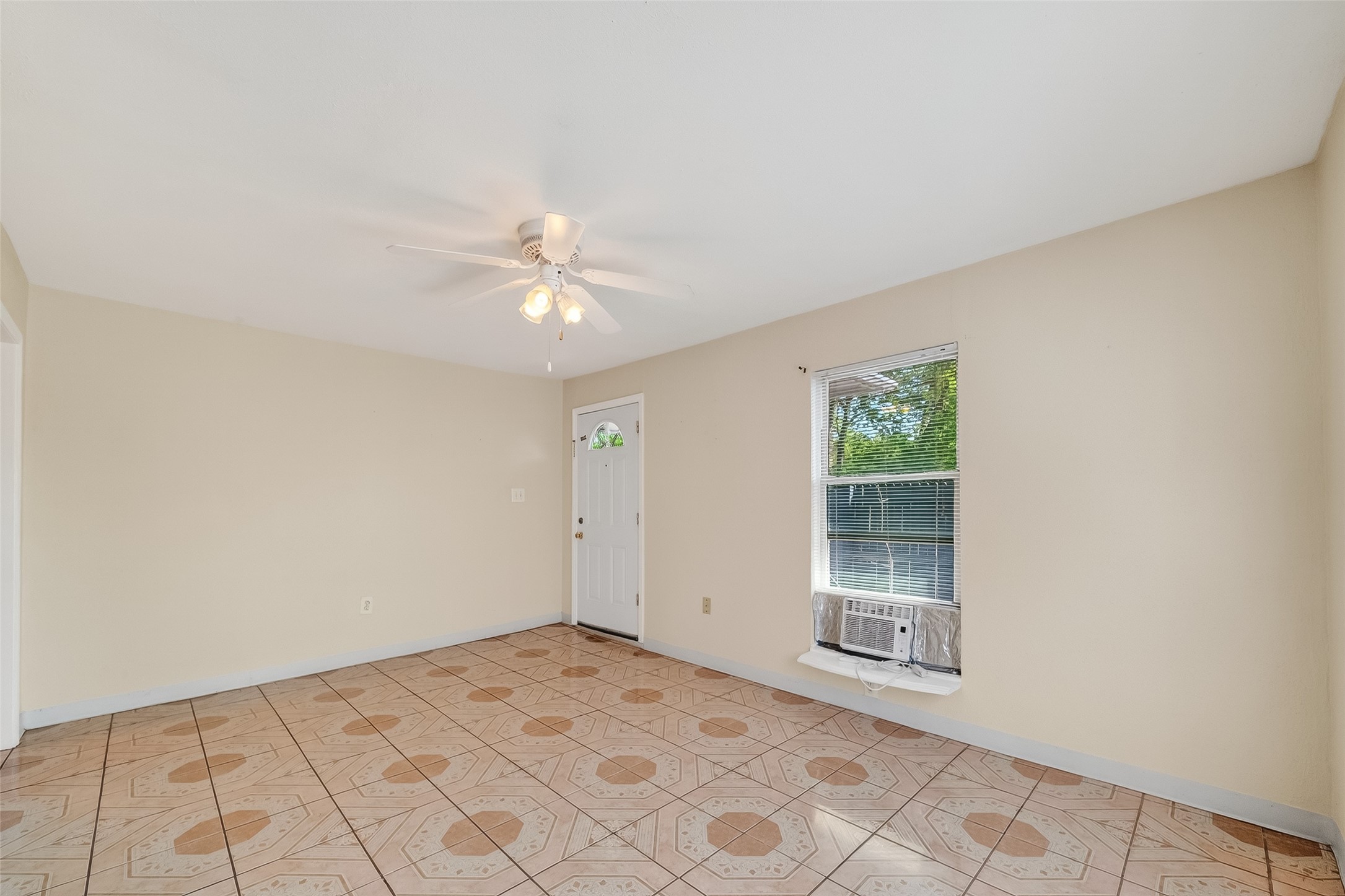 968 Garapan Street Houston, TX 77091 - Photo 8 of 40 wooden floor in an empty room with a window