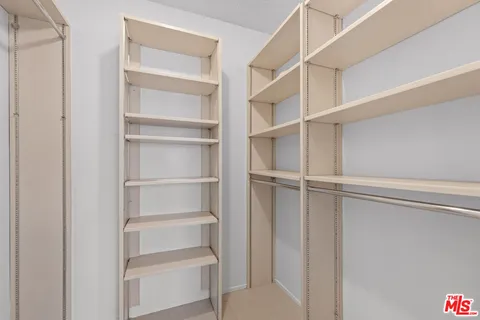a view of an empty walk in closet