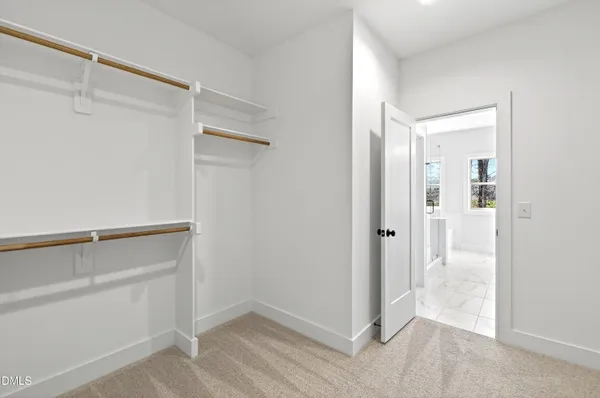 a view of an empty walk in closet