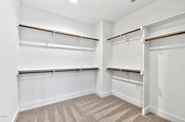 a view of an empty walk in closet