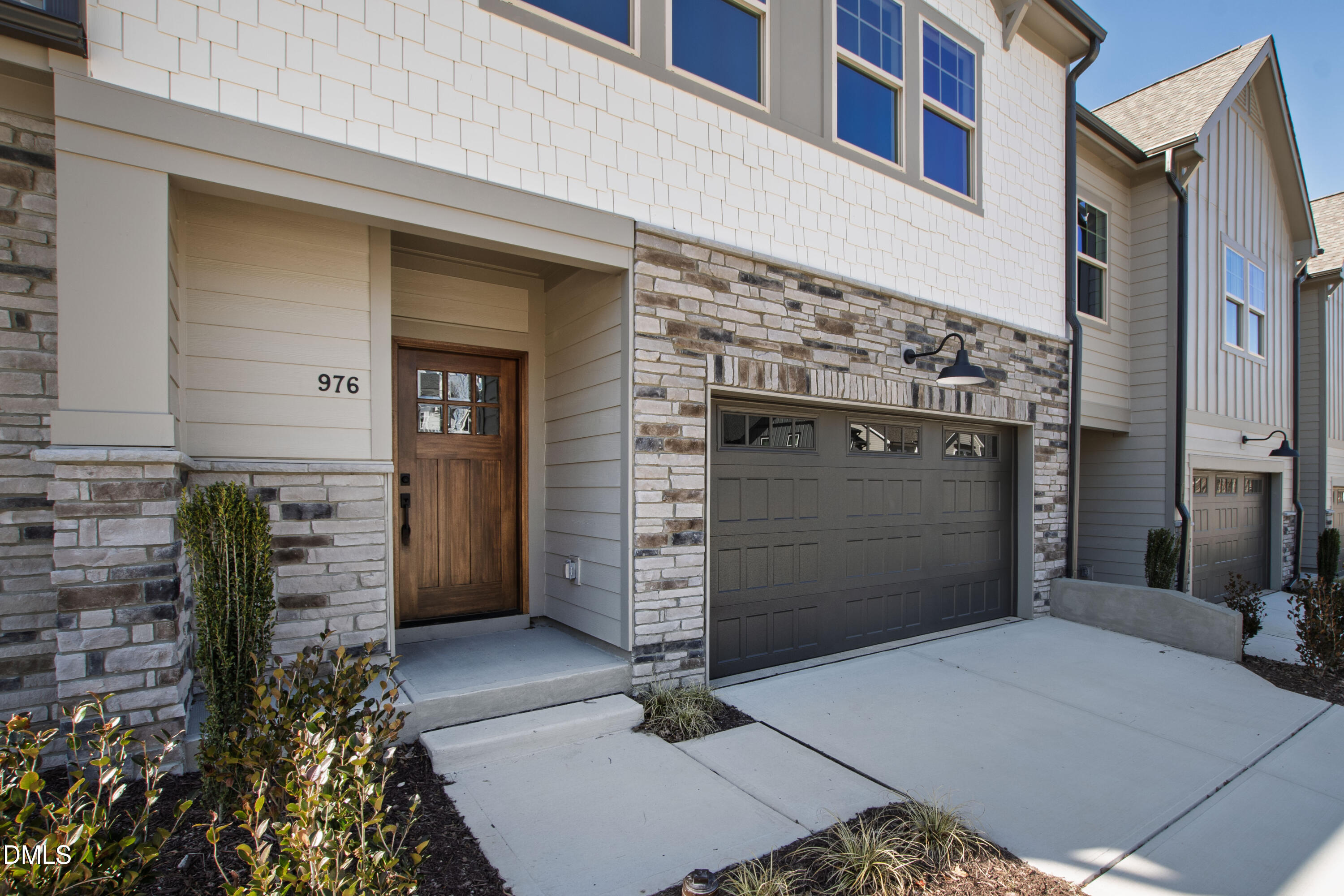 976 Double Helix Road Apex, NC 27523 - Photo 5 of 50 a front view of a building with entryway