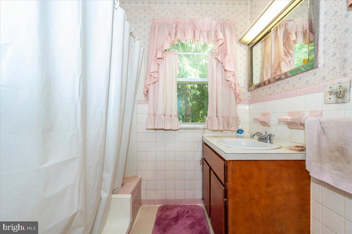 6109 Ford Road Frederick, MD 21702 - Photo 25 of 59 a bathroom with a sink a vanity and a shower