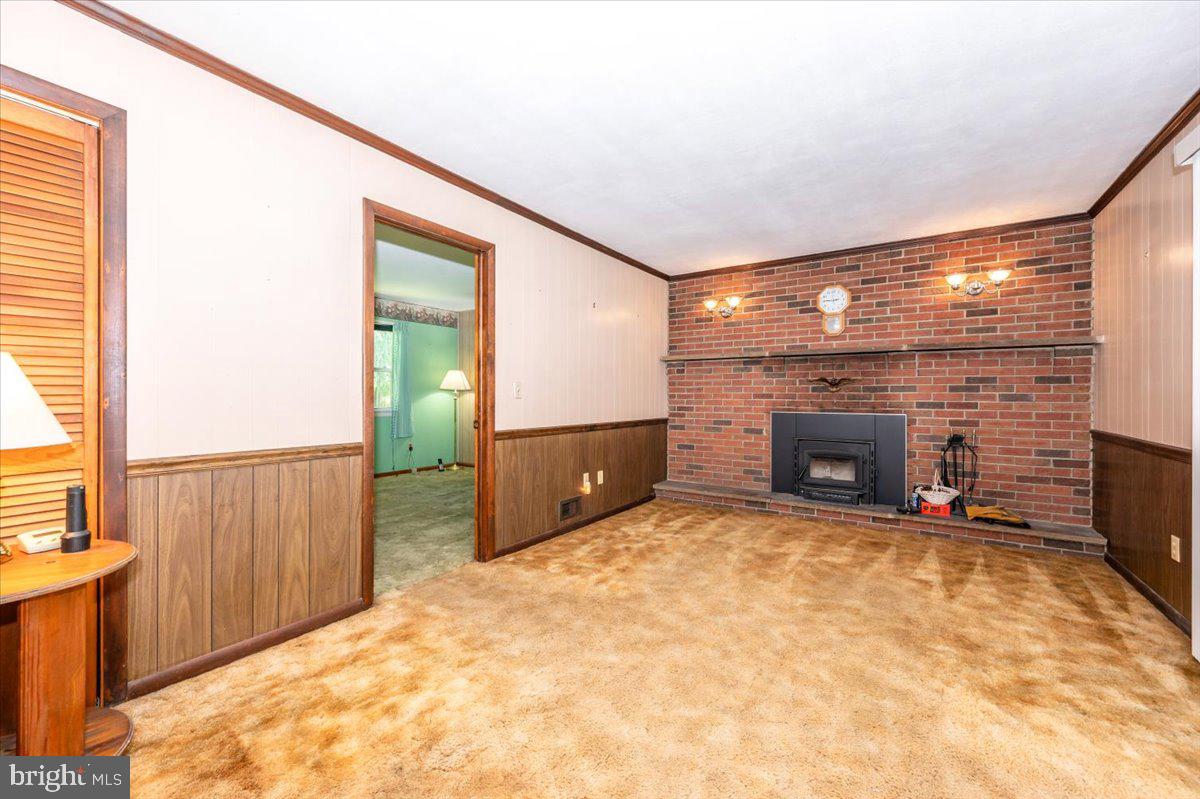 6109 Ford Road Frederick, MD 21702 - Photo 3 of 59 a view of an empty room with a fireplace