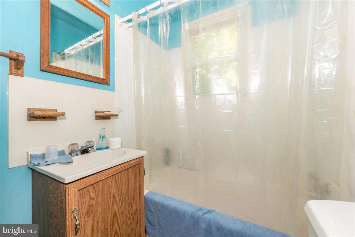 6109 Ford Road Frederick, MD 21702 - Photo 33 of 59 a bathroom with a sink and a mirror