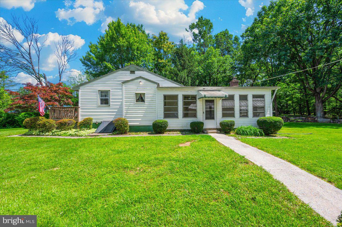 6109 Ford Road Frederick, MD 21702 - Photo 44 of 59 a view of a house with a yard and potted plants