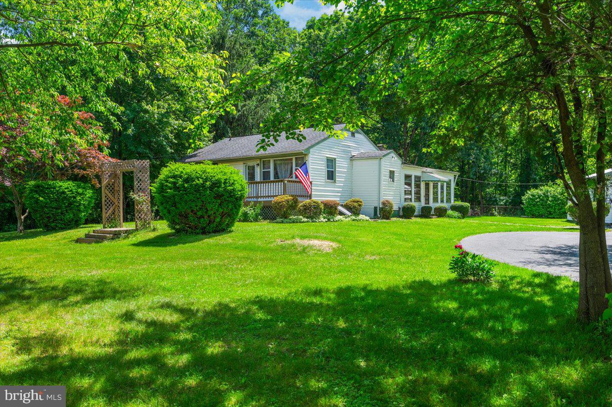 6109 Ford Road Frederick, MD 21702 - Photo 52 of 59 a view of house in front of a big yard with large trees