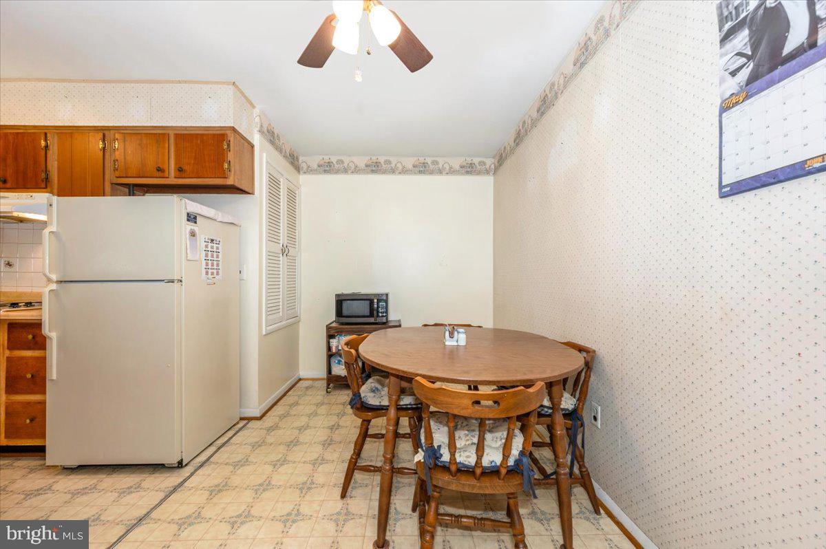 6109 Ford Road Frederick, MD 21702 - Photo 6 of 59 a view of a dining room with furniture and wooden floor
