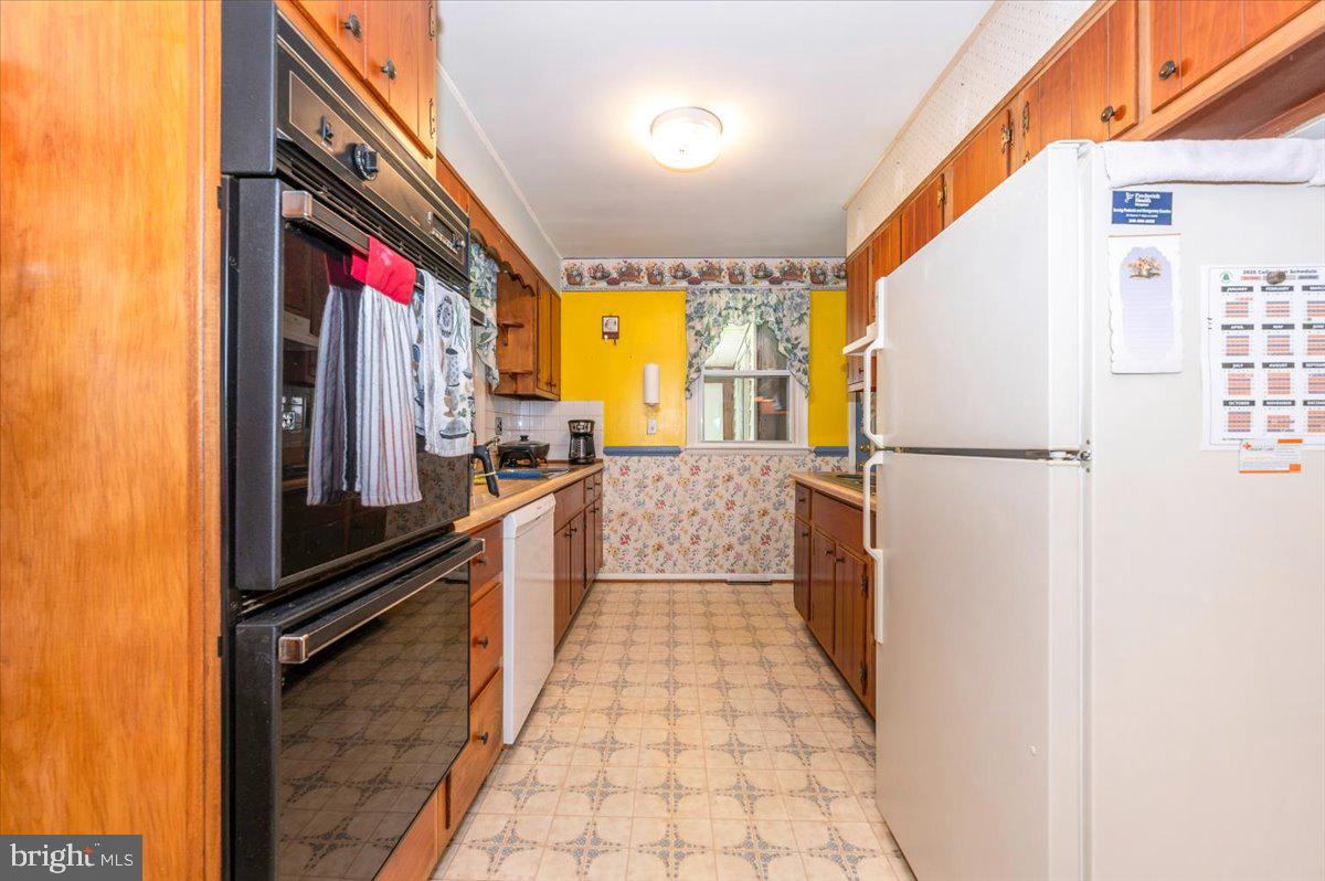 6109 Ford Road Frederick, MD 21702 - Photo 10 of 59 a hallway with a large window in a kitchen