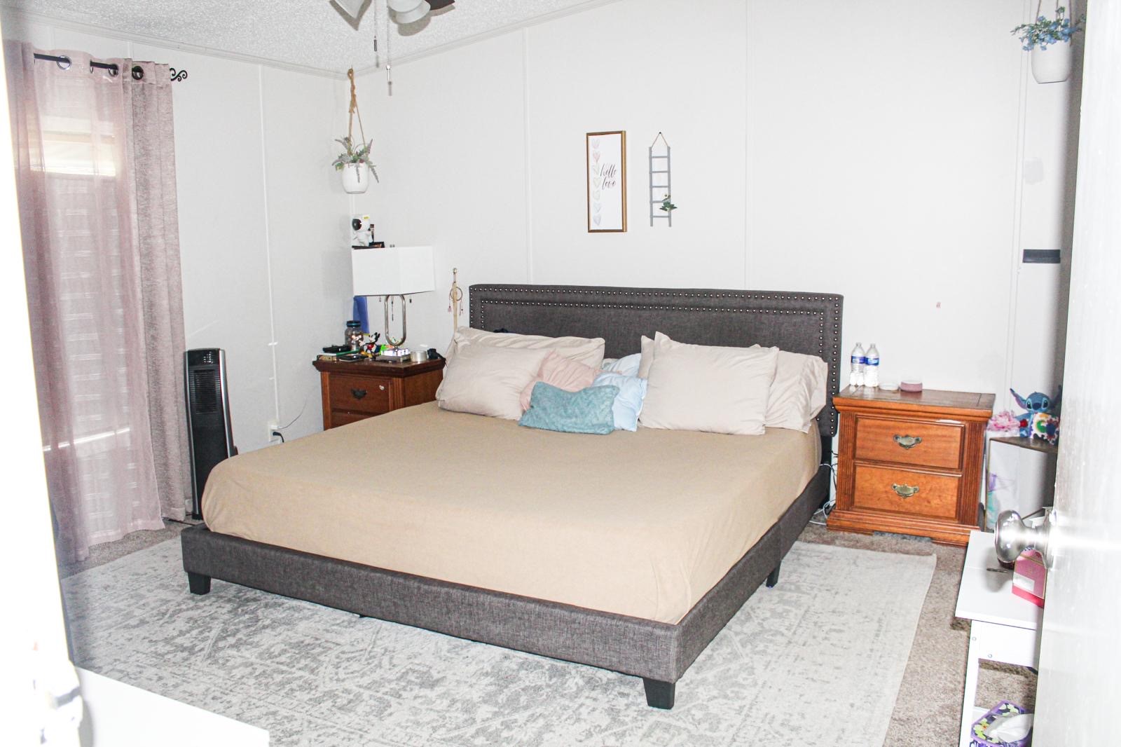 8021 Matthew Steven Drive Conroe, TX 77306 - Photo 12 of 24 a large bed sitting in a bedroom next to a window