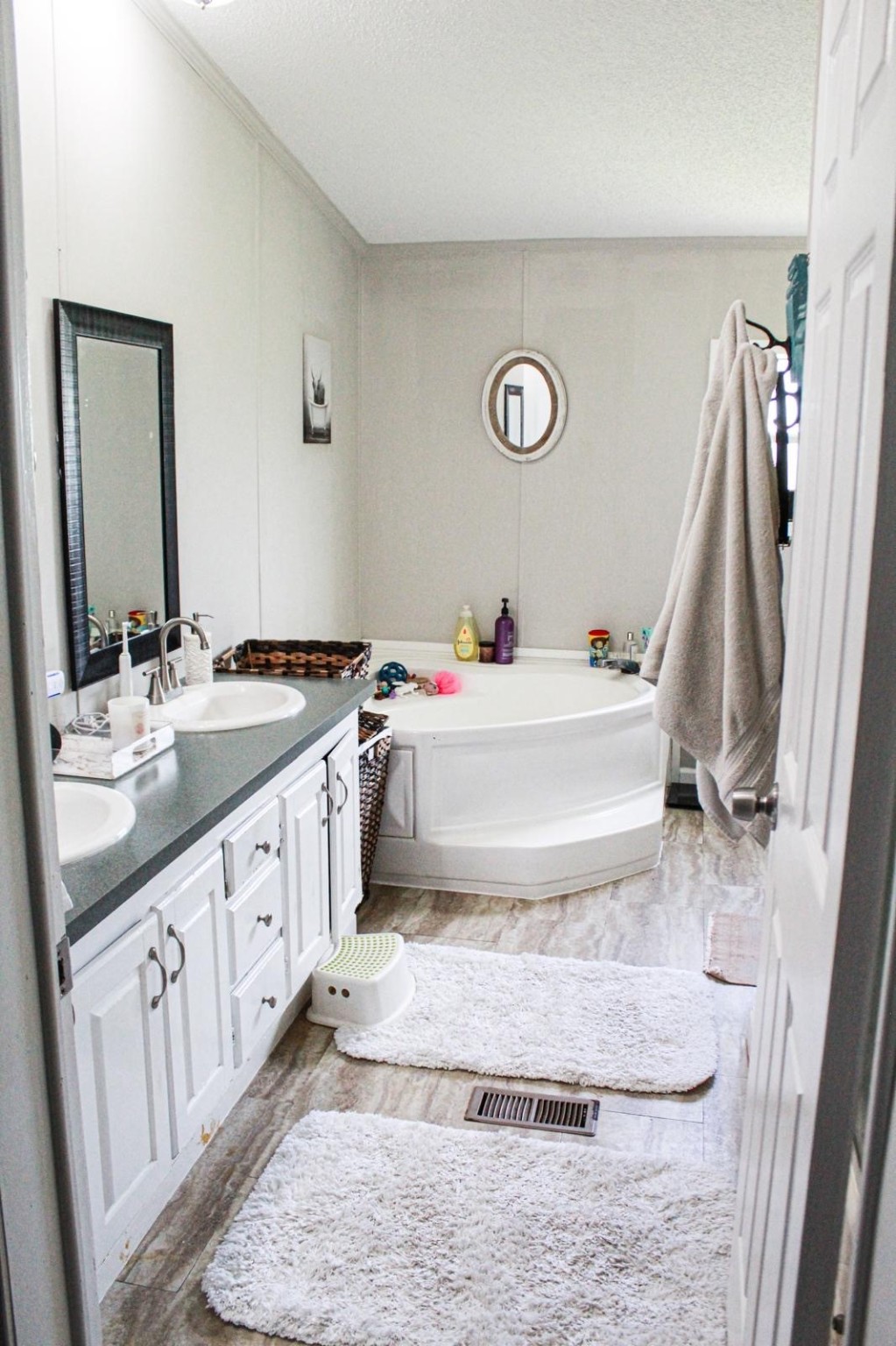 8021 Matthew Steven Drive Conroe, TX 77306 - Photo 14 of 24 a bathroom with a double vanity sink and a mirror