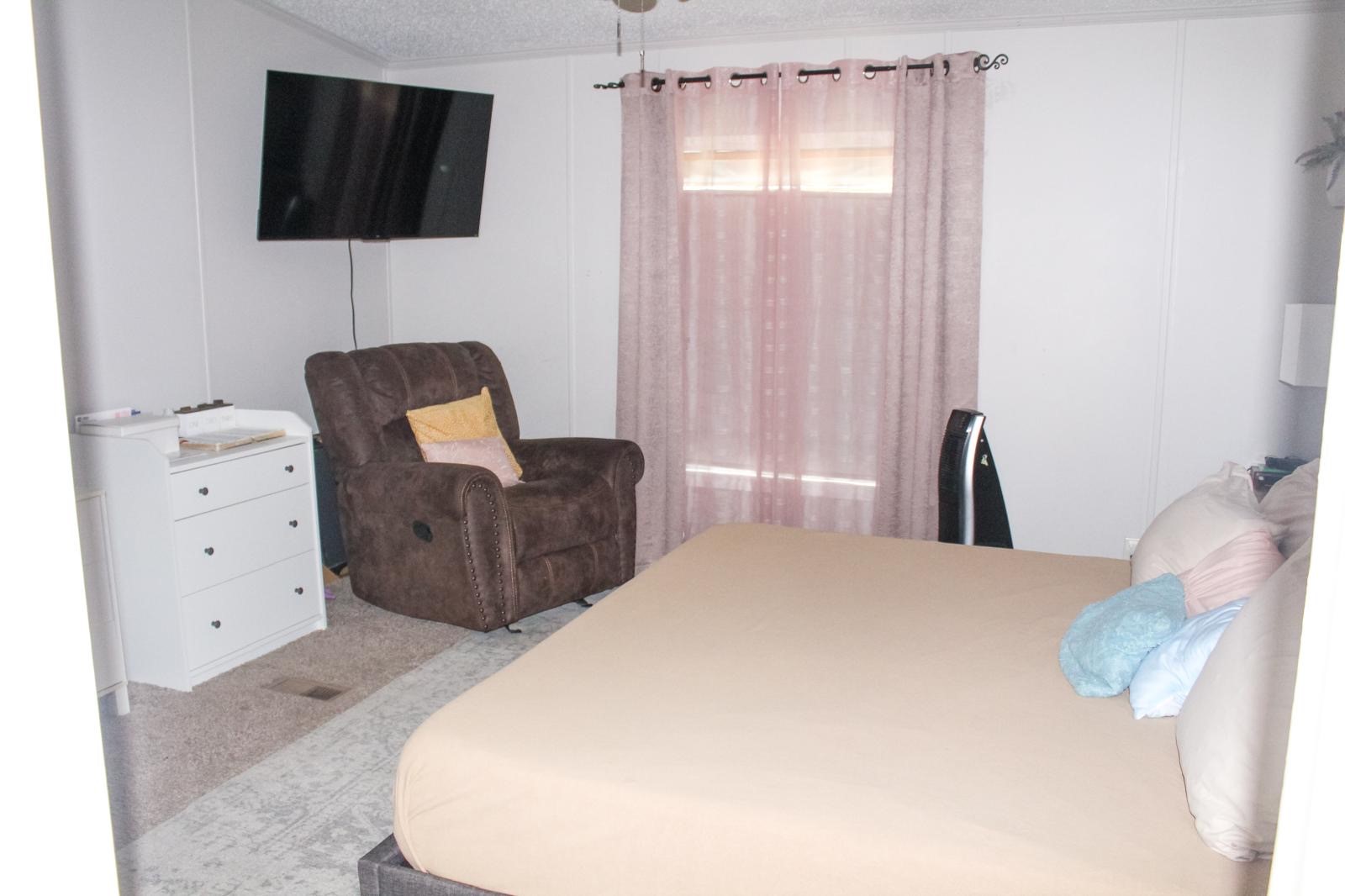 8021 Matthew Steven Drive Conroe, TX 77306 - Photo 15 of 24 a bedroom with a bed and a flat screen tv