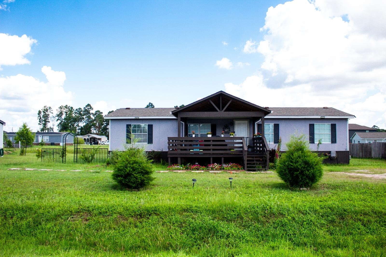 8021 Matthew Steven Drive Conroe, TX 77306 - Photo 2 of 24 a house view with a garden space