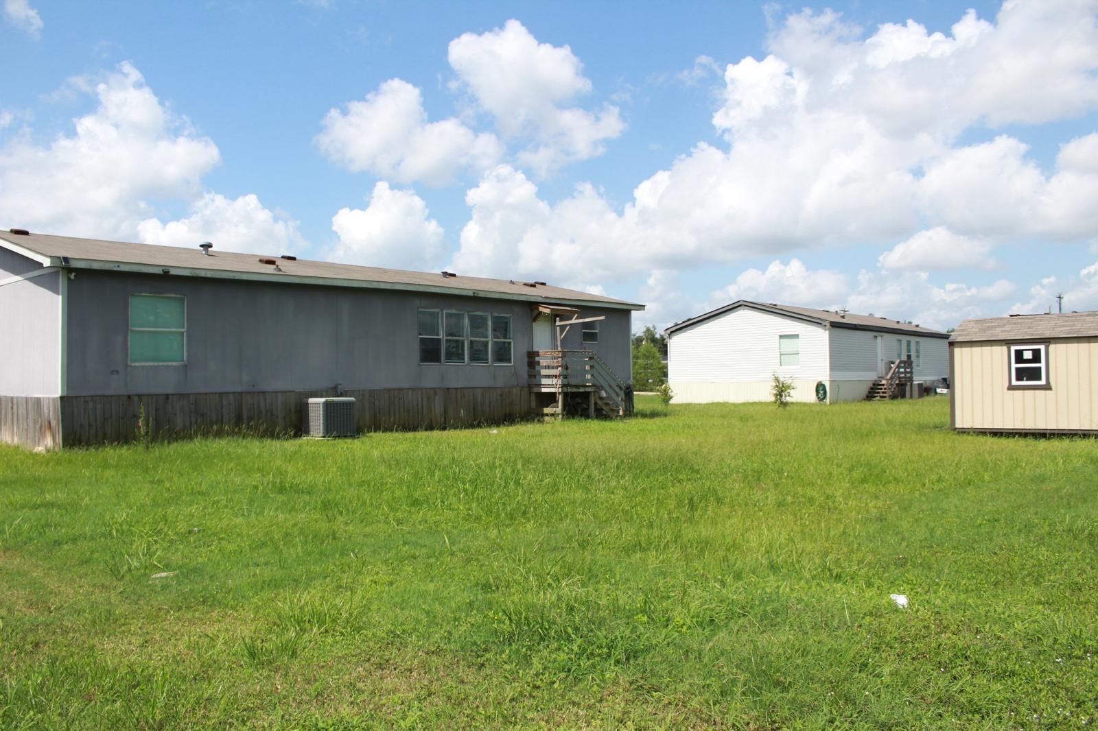8021 Matthew Steven Drive Conroe, TX 77306 - Photo 22 of 24 a front view of house with yard